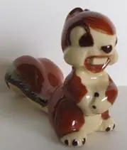 Ceramic figurine of a cartoon squirrel.