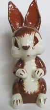 Brown and white ceramic bunny figurine.