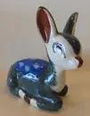 Ceramic fawn figurine with blue and brown glaze.