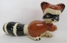 Ceramic figurine of a raccoon.