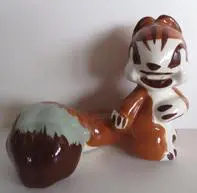 A ceramic figurine of a brown squirrel.