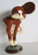 Ceramic figurine of a brown deer fawn.