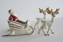 Santa Claus in a sleigh with two reindeer.