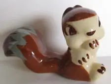 Ceramic figurine of a brown squirrel.