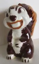 Smiling brown and white ceramic squirrel figurine.