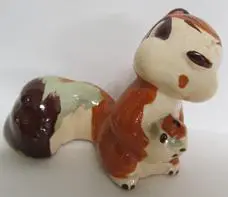 Ceramic figurine of a brown squirrel.