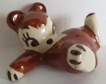 Brown ceramic bear figurine with white accents.