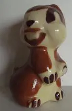 Ceramic figurine of a brown and white bunny.