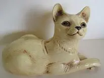 Ceramic figurine of a white cat.