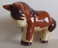 Ceramic figurine of a brown horse.