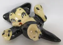 Black and white ceramic cat figurine.