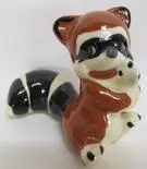 Ceramic figurine of a raccoon.