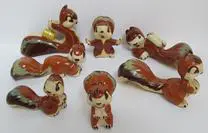 Collection of ceramic squirrel figurines.