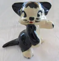 Black and white ceramic kitten figurine.