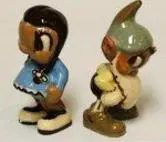 Two ceramic figurines of cartoon characters.