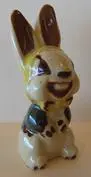 Ceramic figurine of a smiling rabbit.