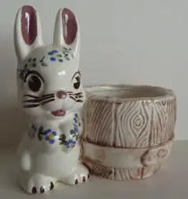 Ceramic bunny planter with a barrel.