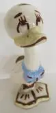 White ceramic duck figurine with blue bow