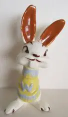 White rabbit figurine with brown ears.