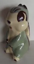 Ceramic figurine of a green and white rabbit.