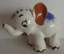 Hand-painted ceramic figurine of a white elephant.