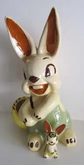 Ceramic rabbit figurine with a baby rabbit.