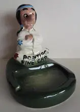 Ceramic ashtray with cartoon Native American figure.