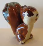 Ceramic figurine of a brown squirrel.