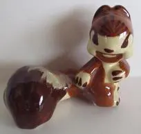 Ceramic figurine of a brown squirrel.