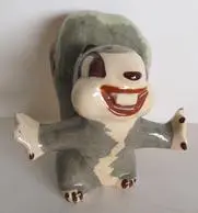 Ceramic figurine of a smiling squirrel.