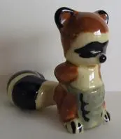 Ceramic figurine of a raccoon.