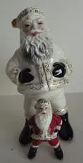 White Santa Claus figurine with a smaller one.