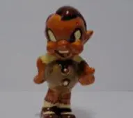 A ceramic figurine of a cartoon boy.