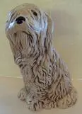 Ceramic figurine of a sitting dog.