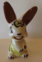 Ceramic bunny figurine with brown ears.