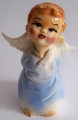 Ceramic figurine of a cherubic angel.