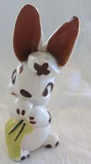 White ceramic bunny with brown ears and spots.