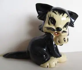 Black and white ceramic kitten figurine.