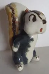 Ceramic figurine of a cartoon squirrel.